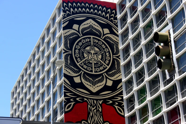 a large decorative object stands in front of a building