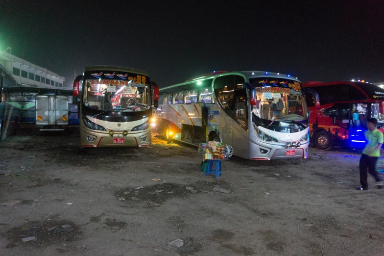 the buses are parked and waiting for passengers