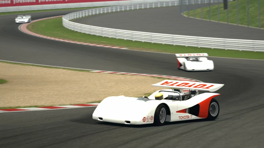 the two cars are racing on the race track