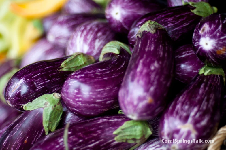 a close up view of eggplant in a basket