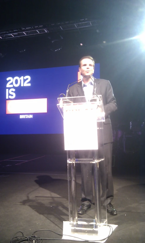 a man giving a speech at the 2012 is 2012