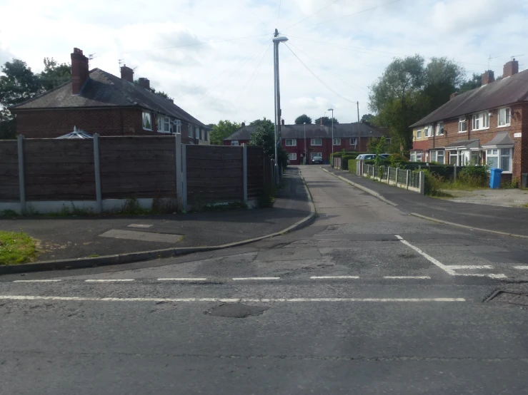 two lane residential street with small row homes