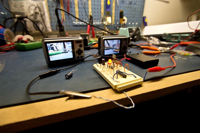 two small televisions on top of a table