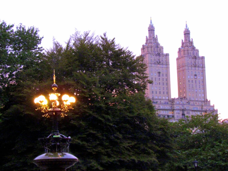 there is an ornate street lamp with lights on it