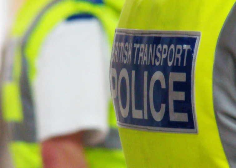 a reflective vest that reads british transport police
