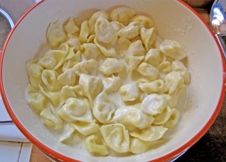 a bowl of noodles on a table