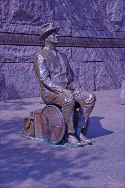 a metal statue sits in front of a building