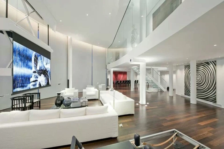 modern living room with large glass ceiling and spiral artwork