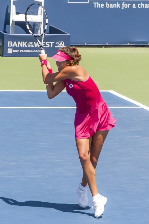 female tennis player waiting to hit the ball