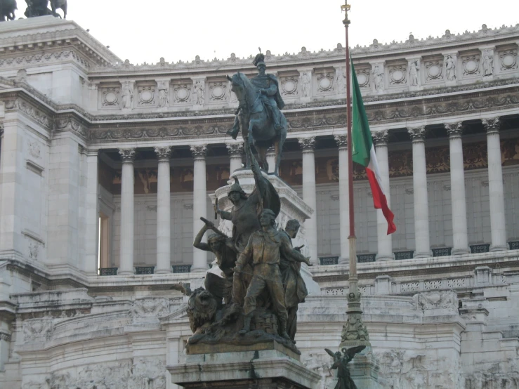 statue with a flag at the base of it