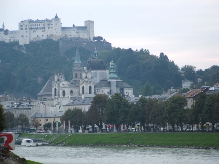 the castle has green steeples on top of it