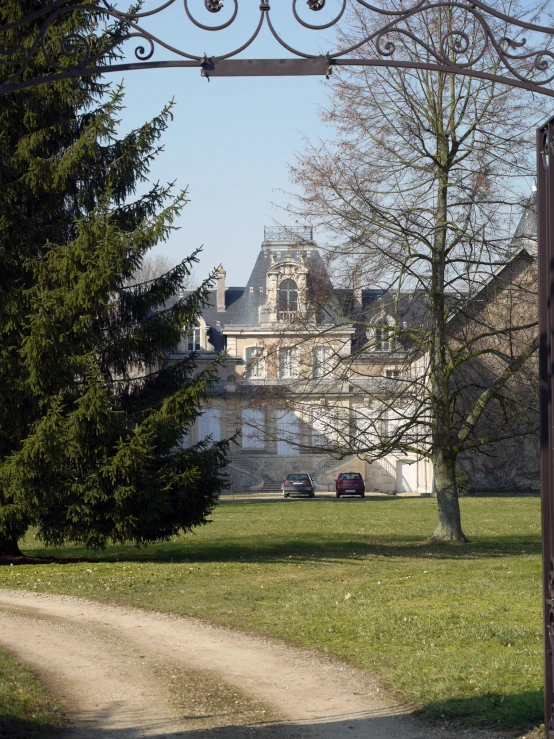 a gate leads from the green to a huge palace