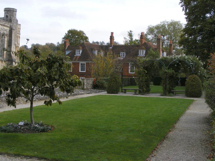 the lawn in front of a large house