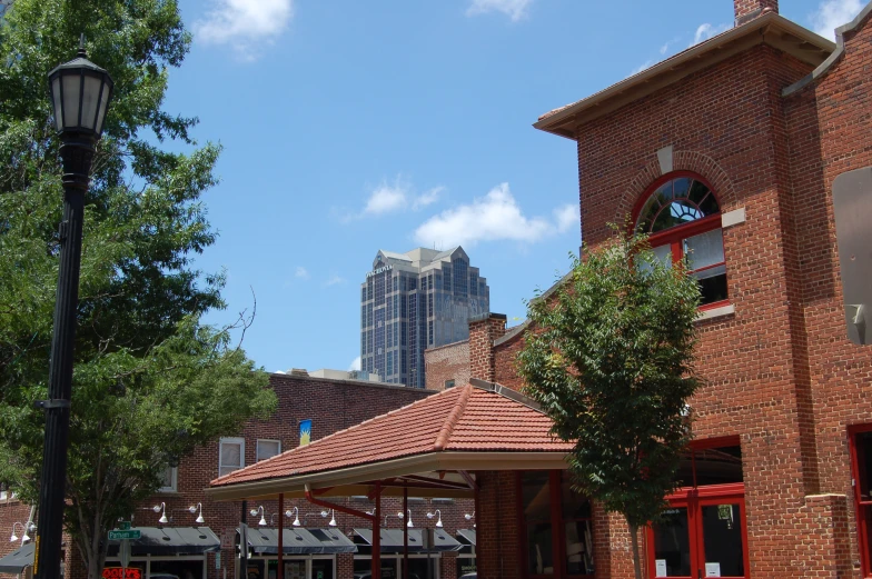 a red brick building with a clock in the front