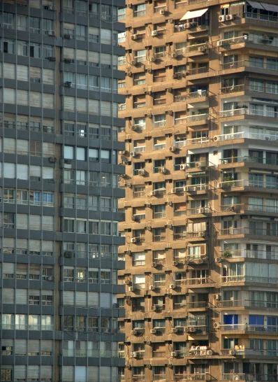 the tall buildings have balconies on each