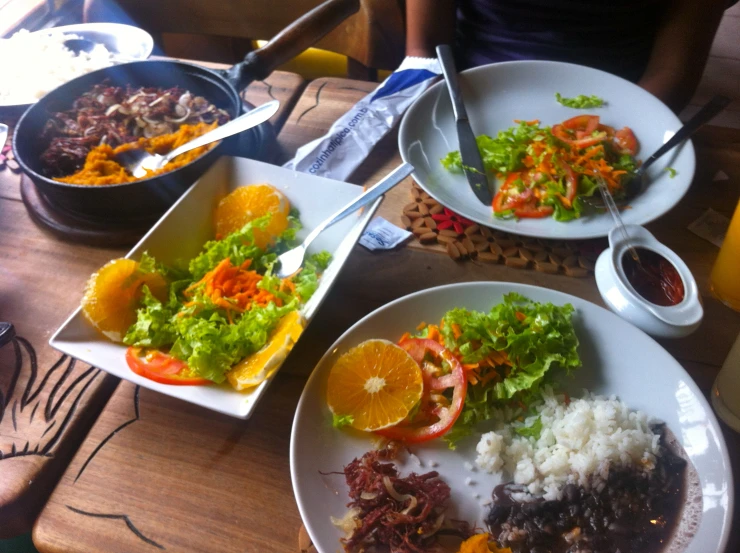 the three plates have various types of food on them