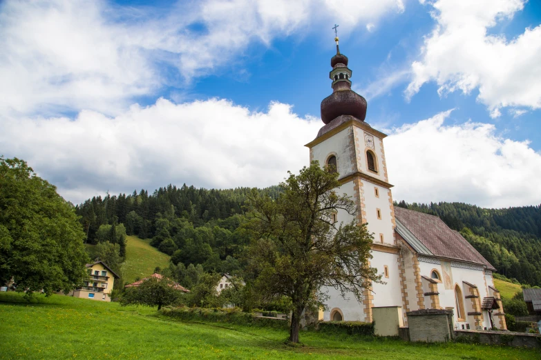 there is a church that has a tower and a dome