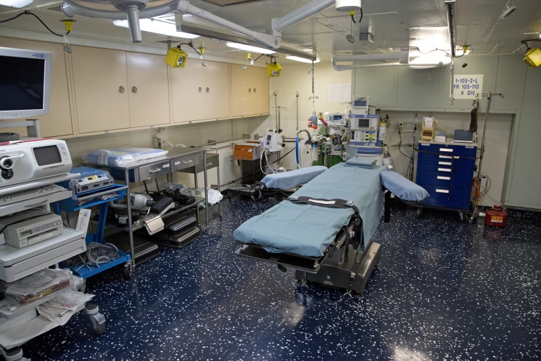 a hospital room with medical equipment around it