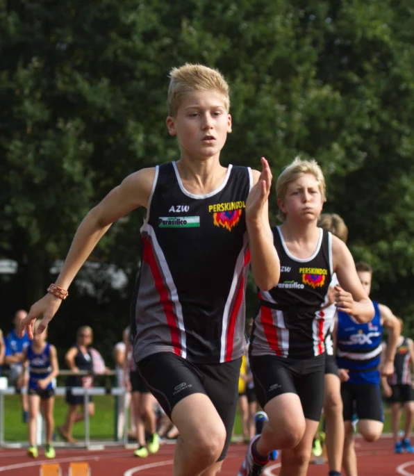 two boys are competing in a track race