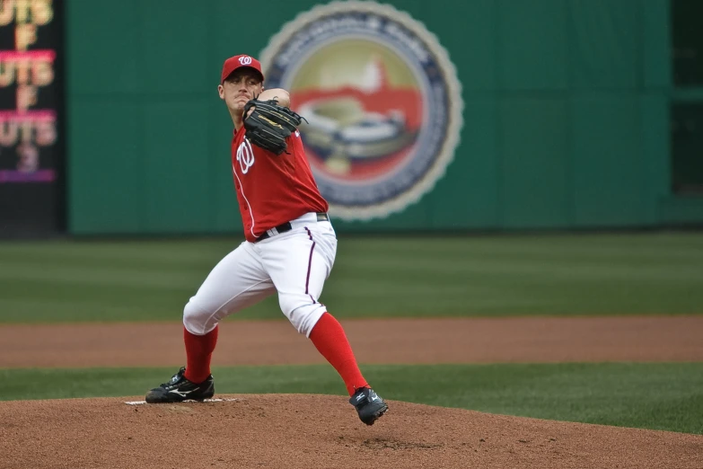 a pitcher is about to throw the baseball