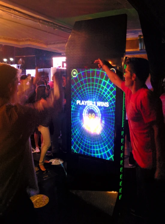 a group of people gathered in a bar playing a game