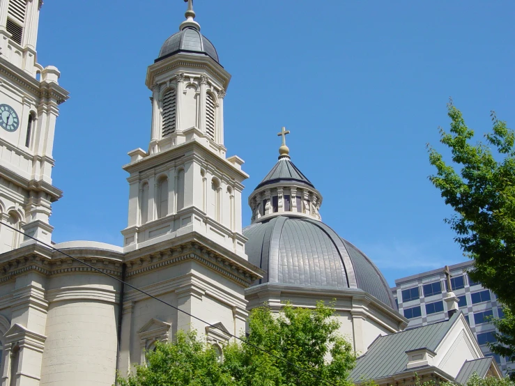 two church bells are positioned on top of two towers