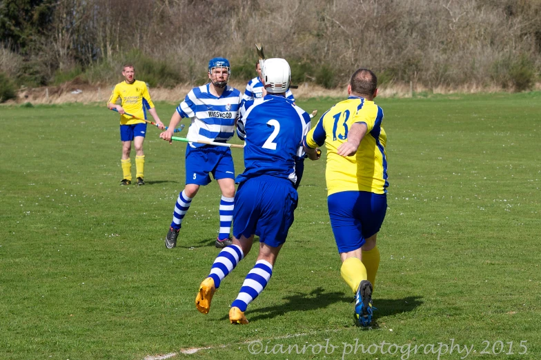 a group of people playing a game of soccer