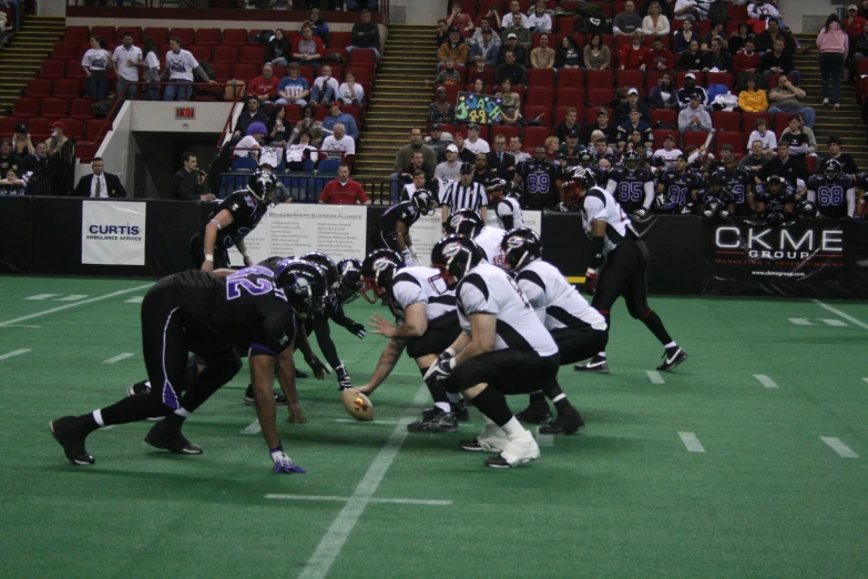 a football game in progress on a grass field