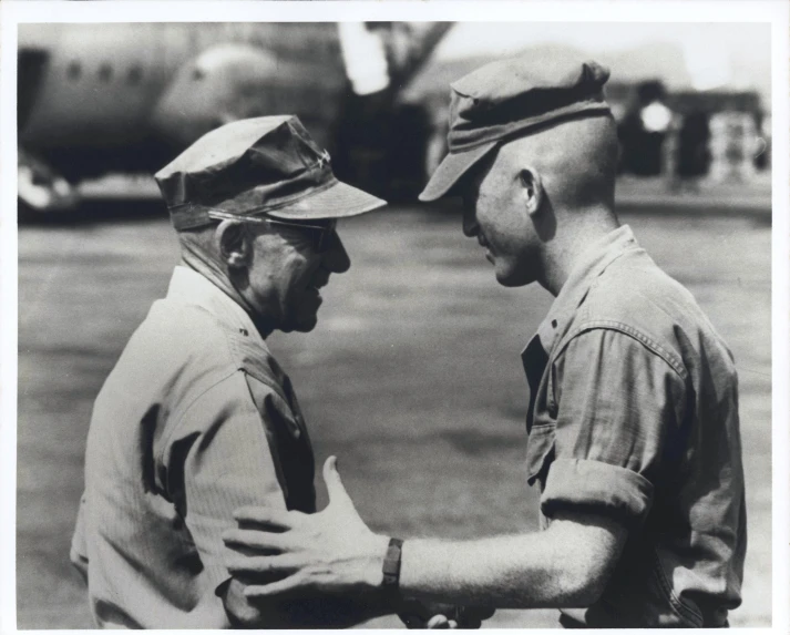 black and white po of two men shaking hands