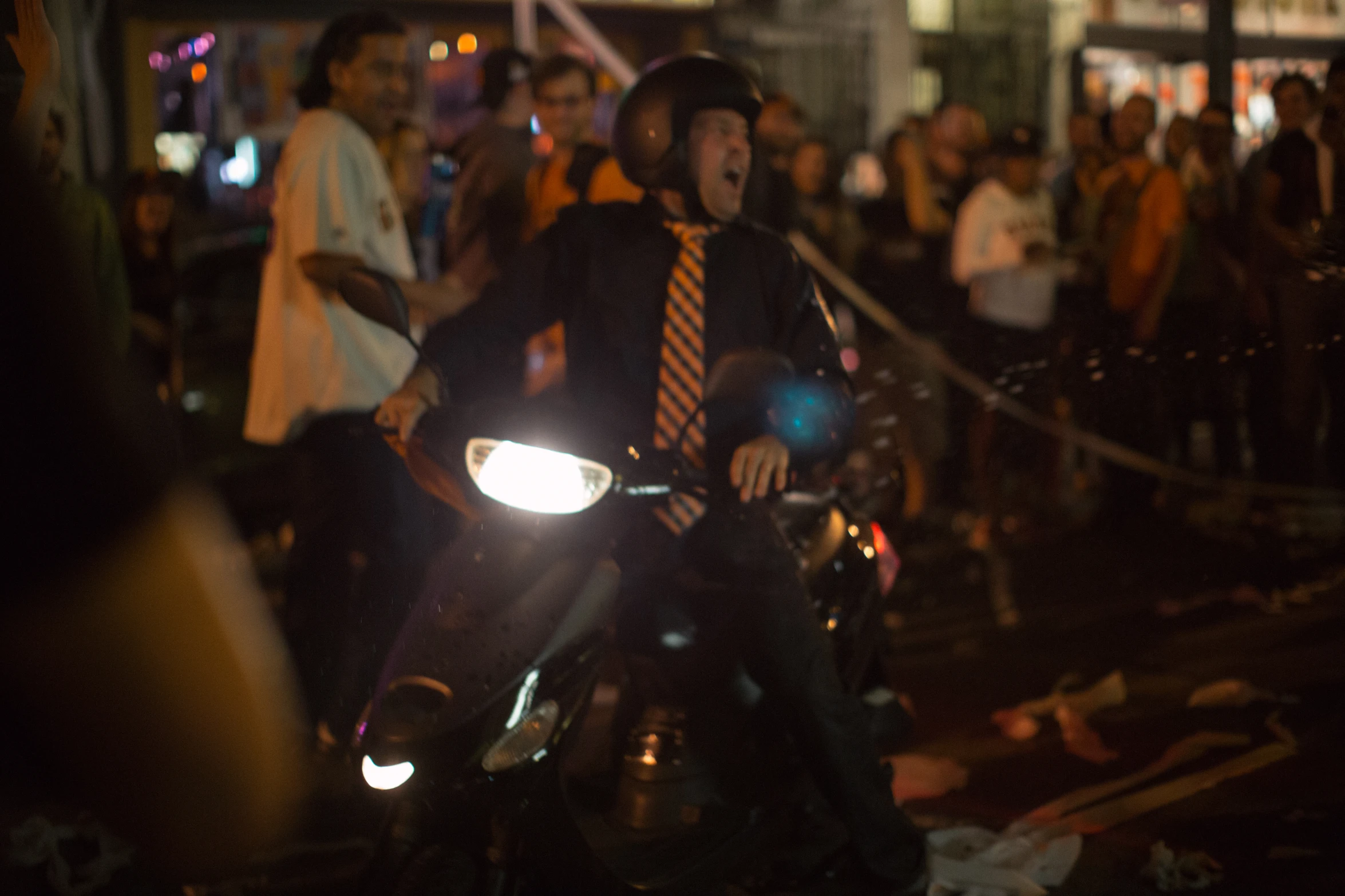 a guy on a motorcycle at night during the night