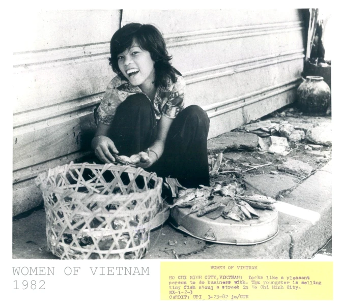 black and white po of a young woman sitting by a basket