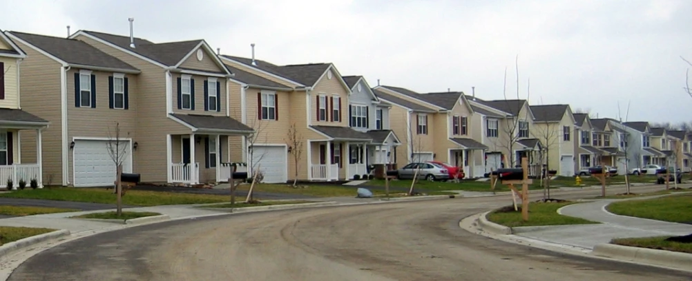 a group of houses on the side of a road