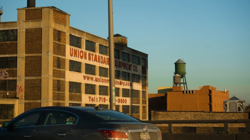 a car parked in front of a large building