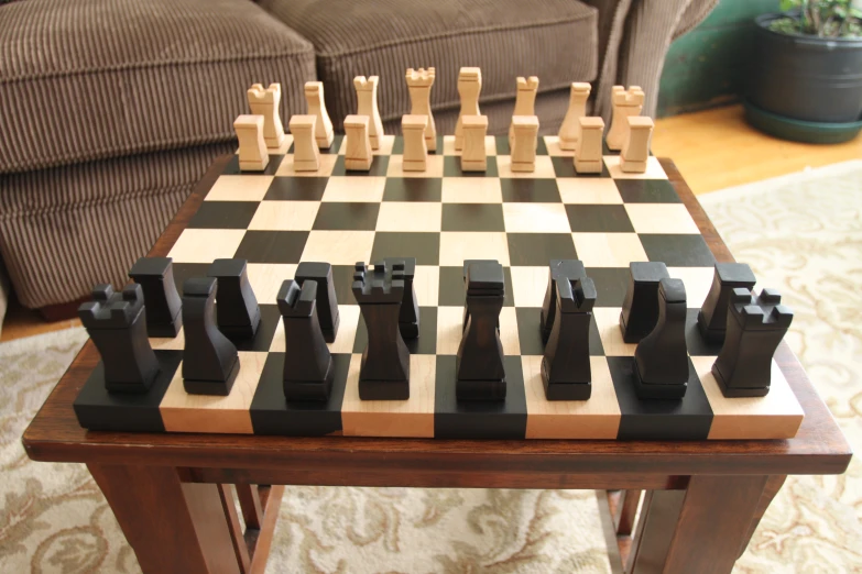 a chess board is set with pieces placed on the floor