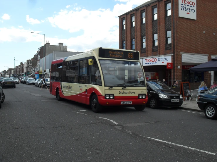 there is a bus that has pulled up to a curb