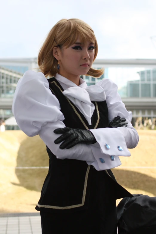 a woman wearing black gloves and white shirt