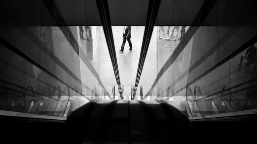 a black and white po with a person walking down the stairs