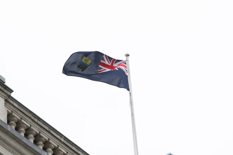 a flag flying from the top of a building