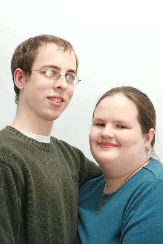 two people pose for the camera for a picture