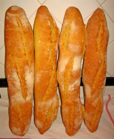 the four loaves of bread have already been cut into smaller pieces