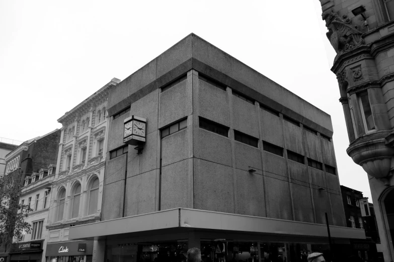 a large building sits in the middle of a city street