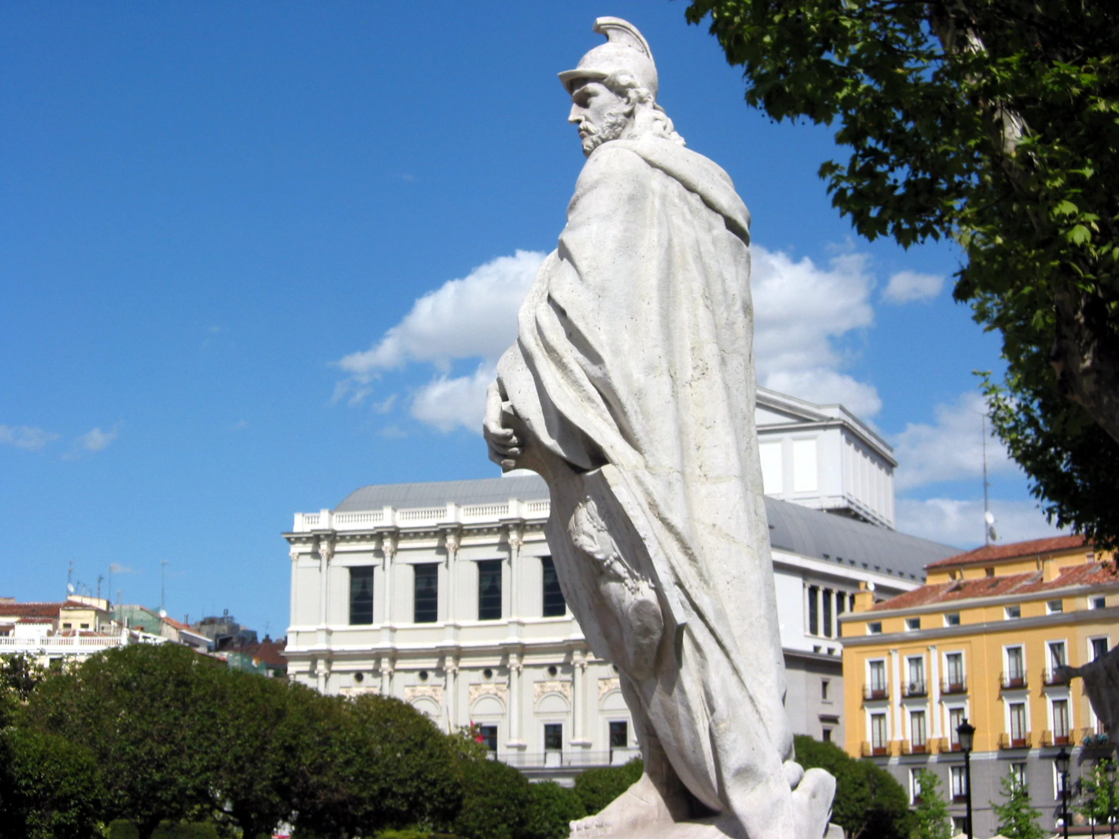 a statue of saint michael the divine in a city park