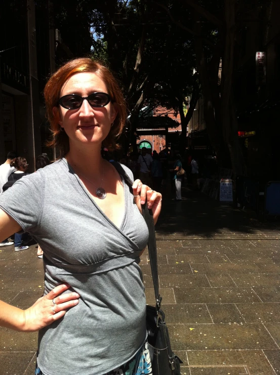 a woman poses for the camera while walking