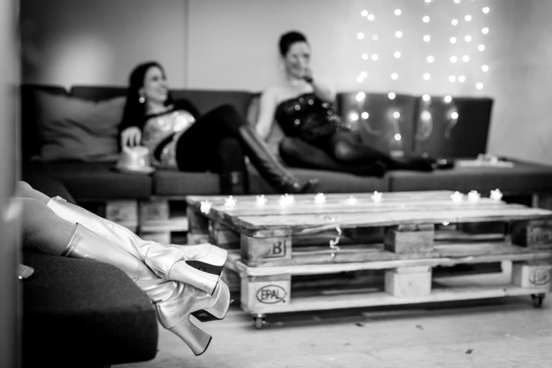 black and white pograph of people in living room