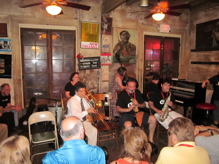 a group of people playing instruments in a room