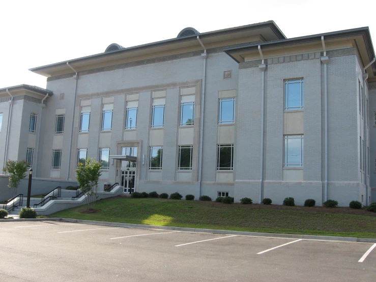 a gray building that is next to a street