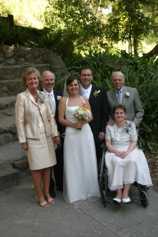 the wedding party looks very happy for each other