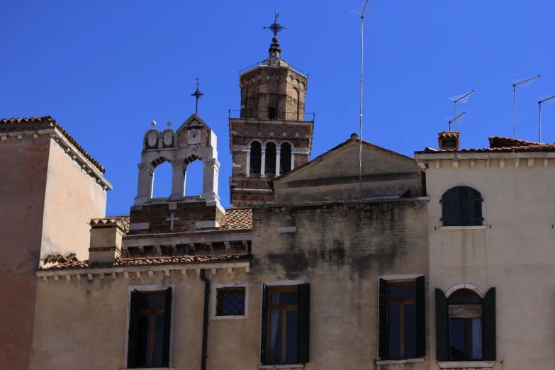 the clock tower is in front of the building