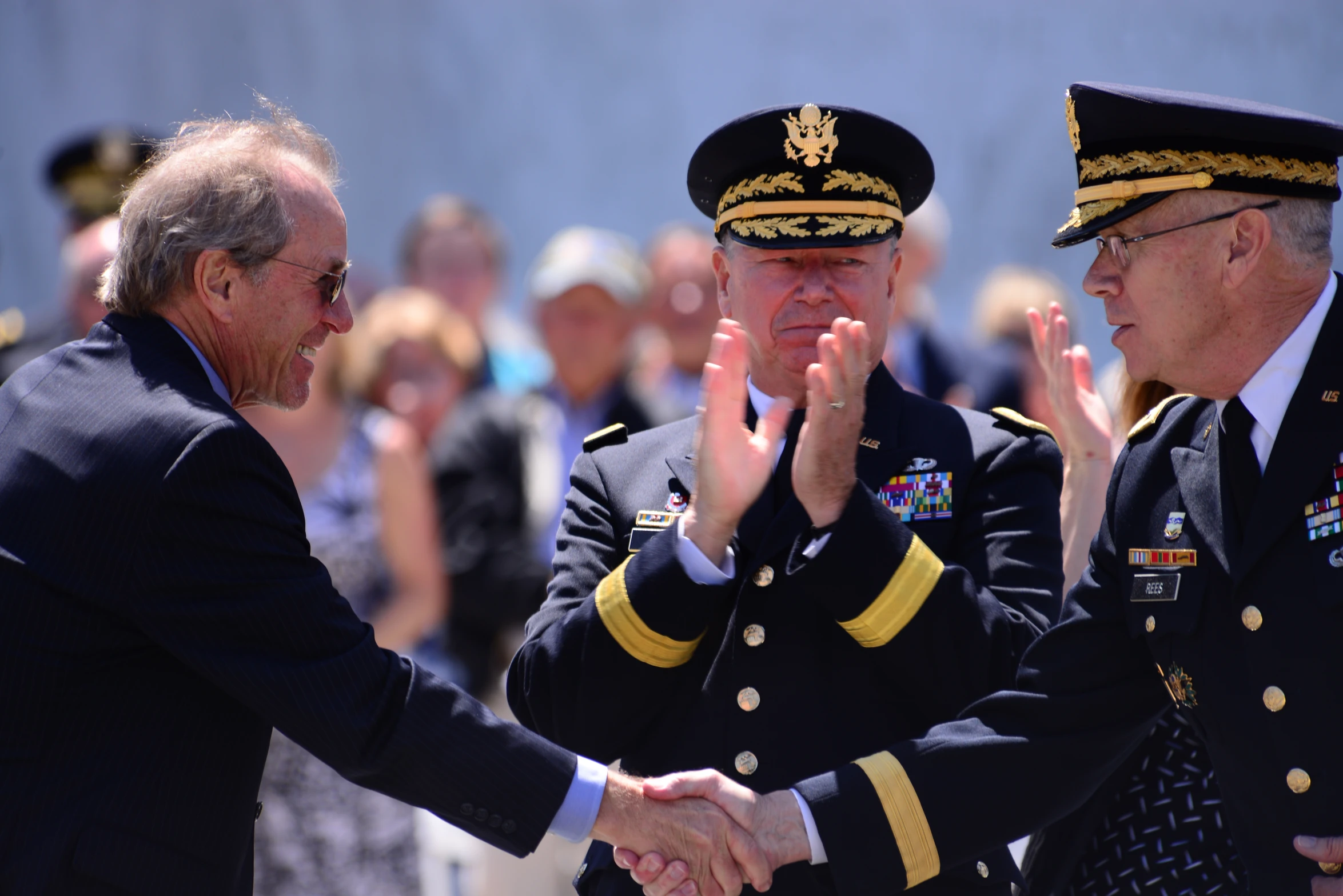 two men in uniform stand side by side