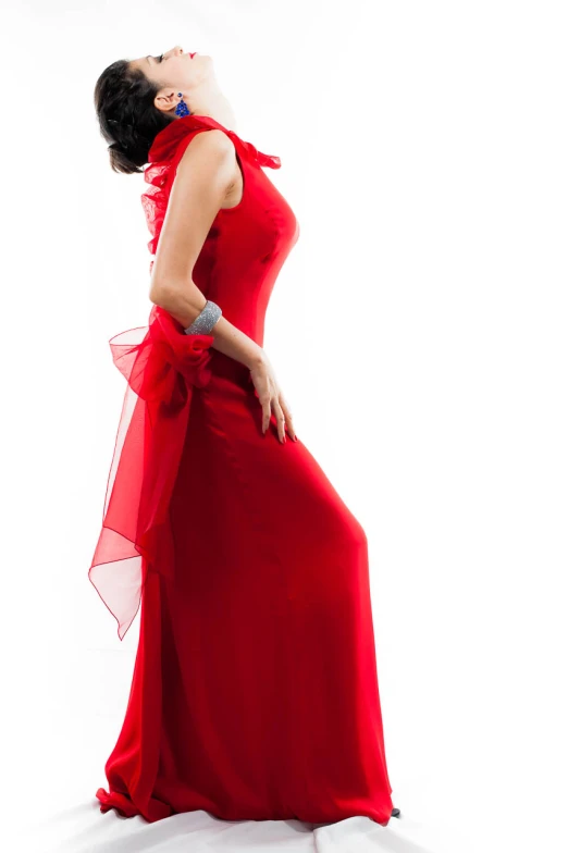 a lady in a red dress posing for the camera